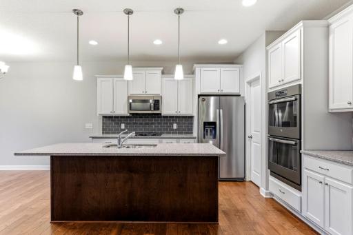 Sleek stainless steel appliances add a polished, modern touch to the kitchen.