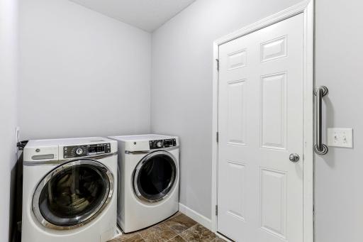 Convenient main-level laundry featuring a bright, organized space designed for everyday ease.