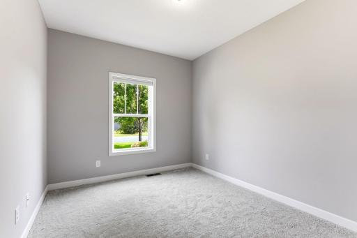 Bright and comfortable second main-level bedroom offering flexible use for guests, family, or a home office.