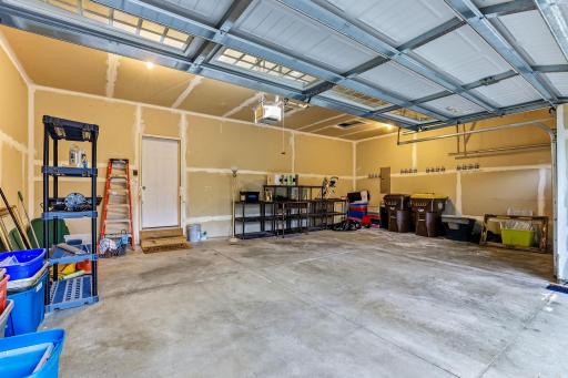 3 car garage is clean, well-organized, and designed for everyday convenience with plenty of space to keep everything neatly arranged.