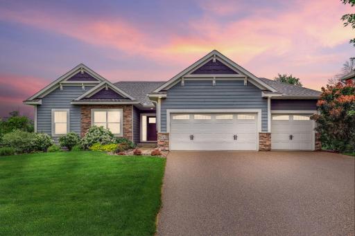 Expansive three-stall garage offering generous space for vehicles, storage, and hobby use.