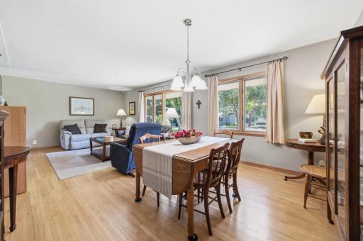 Light & bright living room / dining room with beautiful hardwood floors