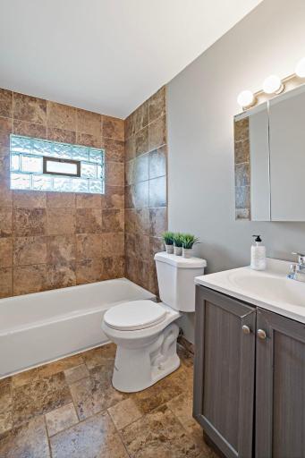 Unit 3810 - Main Level Full Bathroom has updated vanity and mirrored storage cabinet.