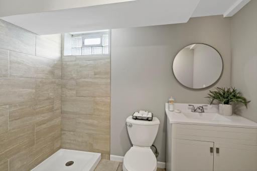 Unit 3810 - There is a beautiful updated 3/4 Bath with new white enameled vanity w/quartz countertop, large shower w/decorative tile surround and glass block window that opens!