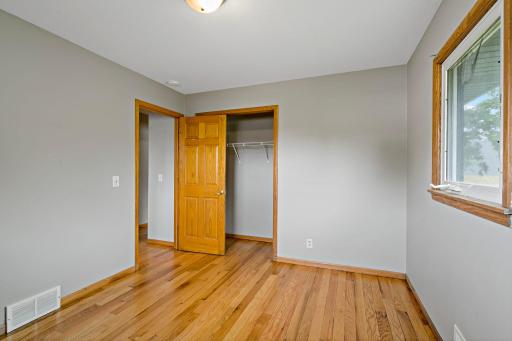 Unit 3810 - Second Bedroom on Main Level has generous closet, updated windows and 6-panel entry door.