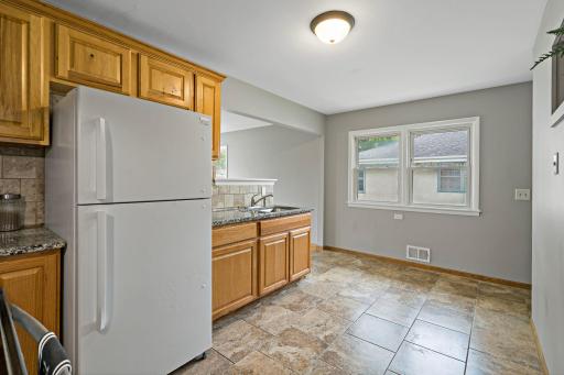 There is a double window for added light in the Kitchen. There is room for a Kitchen table in front of the window.