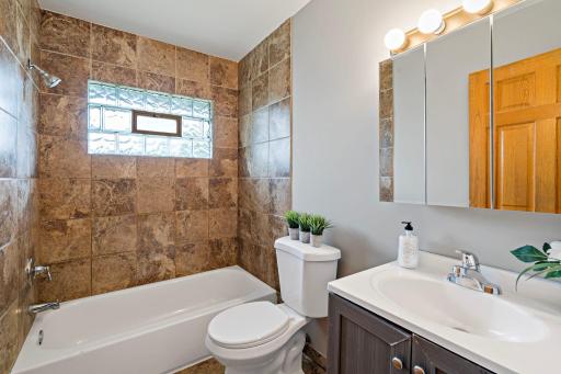 Unit 3810 - Full ML Bath has ceramic flooring, ceramic tile surround and glass block window that opens!