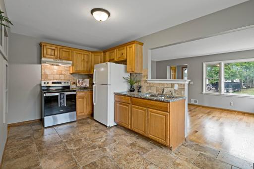 Unit 3810 - Kitchen updated 2022 w/granite countertops and tile backsplash. New range and refrigerator 2025.