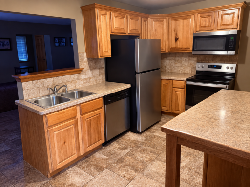 Unit 3012 - Updated Kitchen w/oak cabinets, ceramic flooring, tile backsplash , new ss range 2026 and new ss refrigerator 2025.