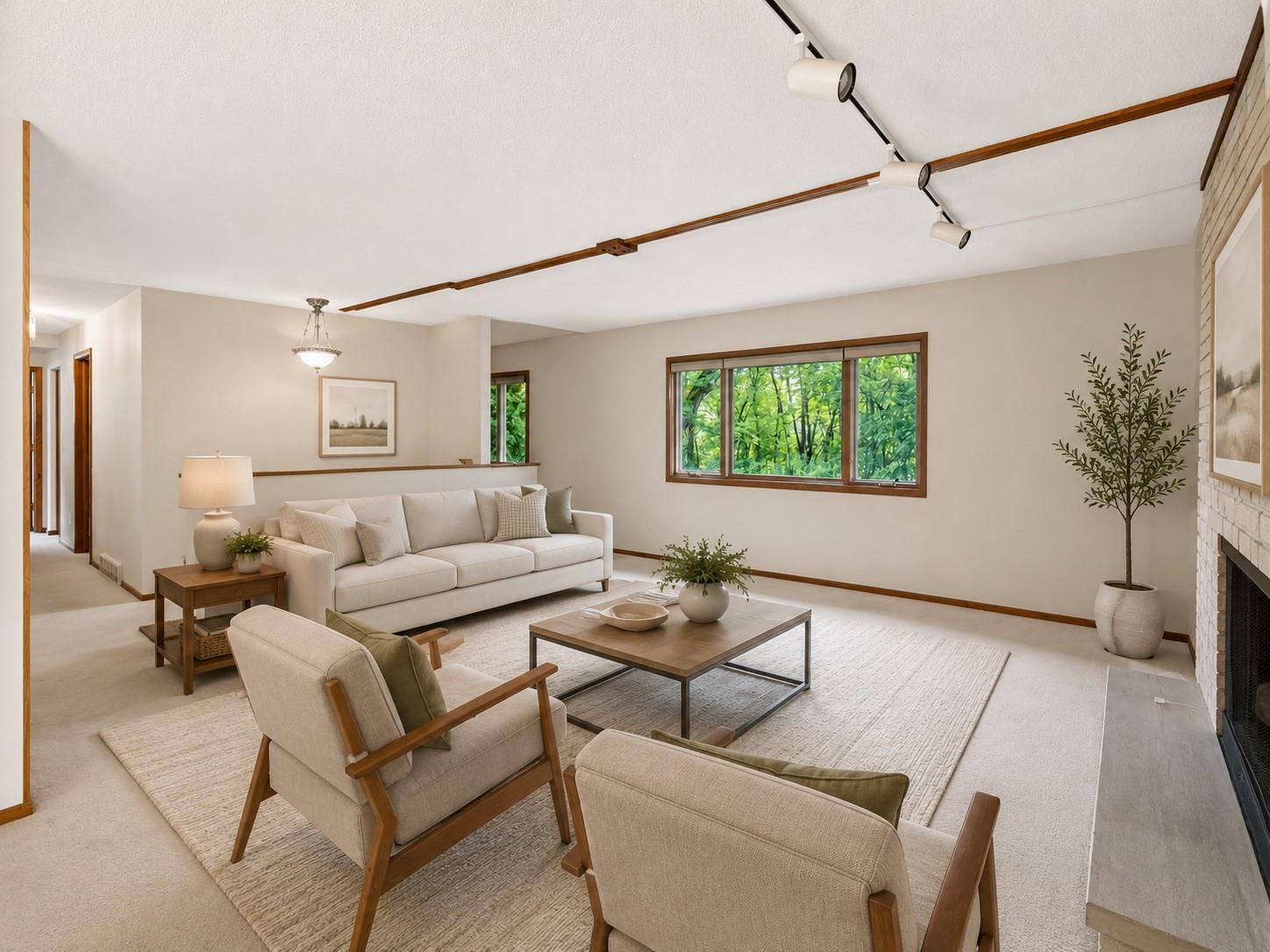 AI Virtually staged - with updated flooring, wall paper and decorative mantel removed.