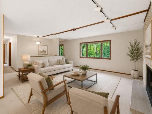 AI Virtually staged - with updated flooring, wall paper and decorative mantel removed.