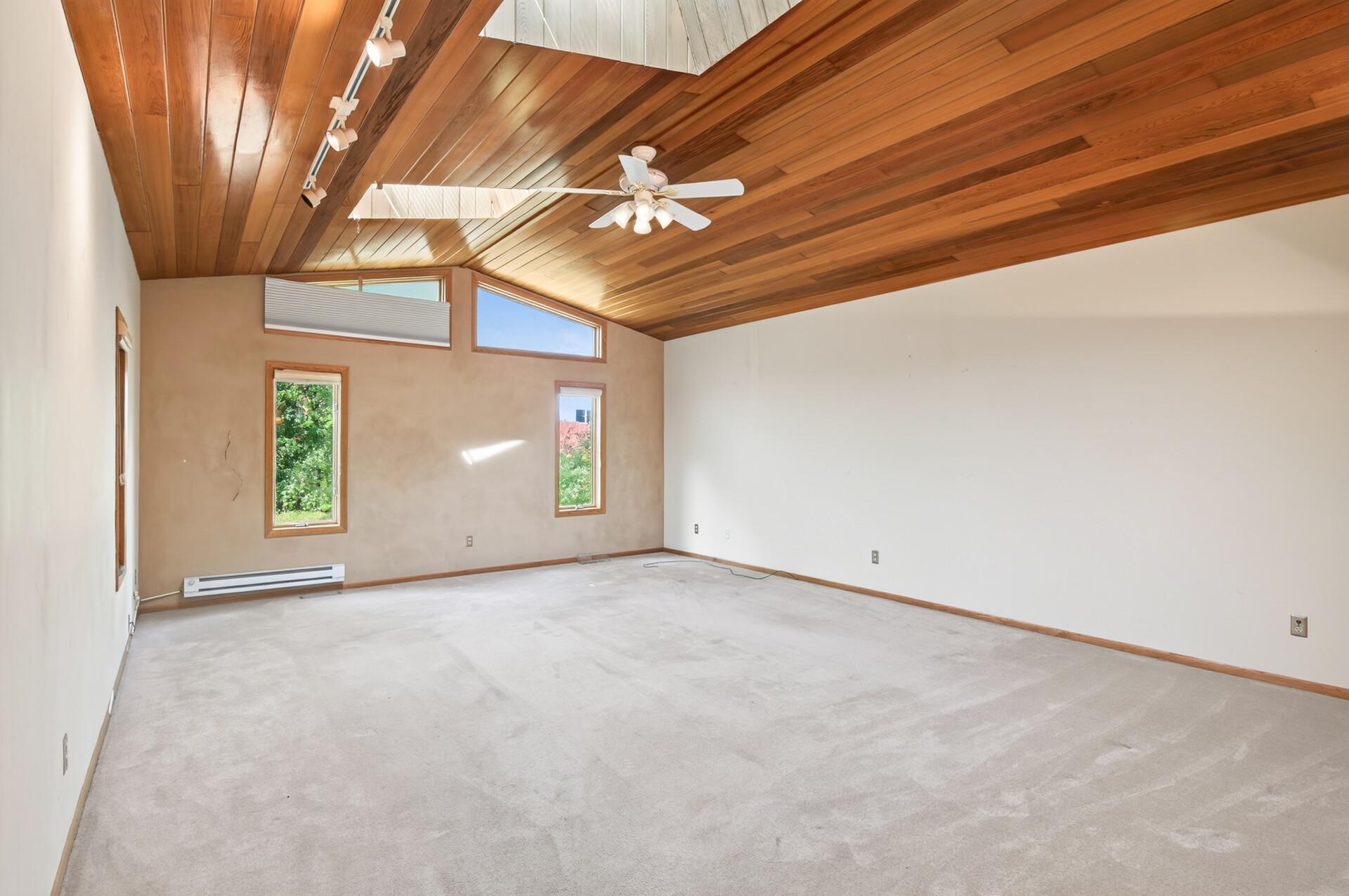 Tons of natural light from sky lights and windows to back yard