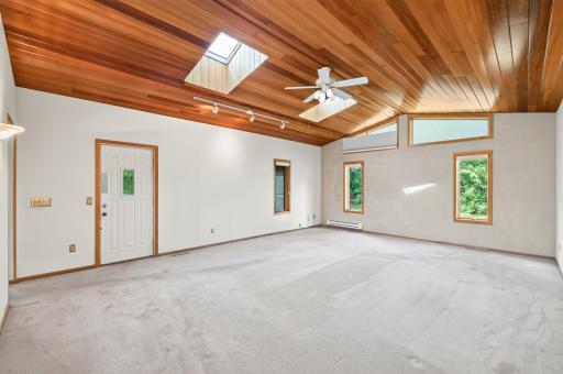 Vaulted ceilings, large family room with access to side porch