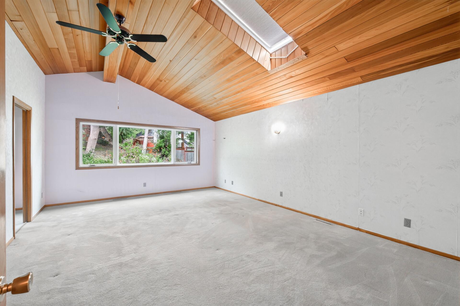 Large primary bedroom with tons of light!