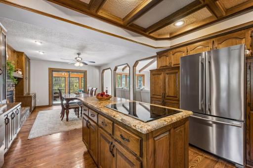 The kitchen is open to the dining area for easy service and has sight lines to the living room and sunroom so you can stay connected.