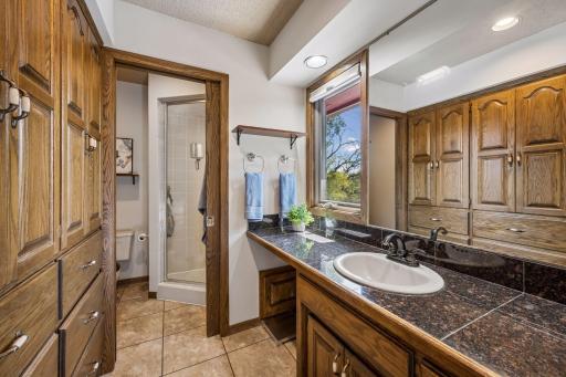 The owners suite has a private dressing area with custom built-in cabinetry as well as a separate stool/shower area with pocket door and luxurious steam shower option.