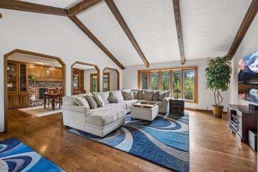 The living room is spacious enough for two seating groups and can comfortably accommodate your largest furniture.