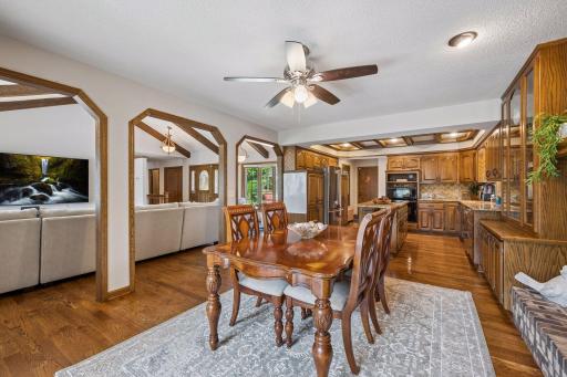 The spacious dining room is large enough to accommodate all of your guests. It features rich hardwood floors, a wall of built in cabinetry and a cozy gas fireplace for warmth and ambience.