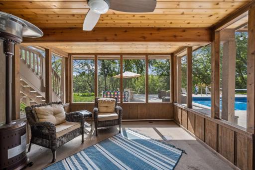 The scenic screened porch is under the sun room and with it's breezy ceiling fan, it is perfect for relaxing on those warm summer days.