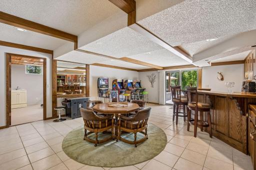 The walkout level family room makes a great game room and entertaining space. Sliders lead directly to the pool deck and rear yard.