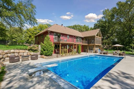 The pool area has a full chain link fence and the side yard has privacy fencing.