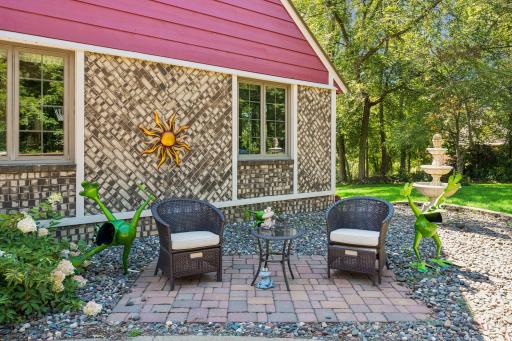 A paver patio in front provides a delightful focal point and first impression for guests.