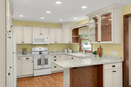 Kitchen cabinetry was updated and includes soft-close drawers and convenient pull-outs.