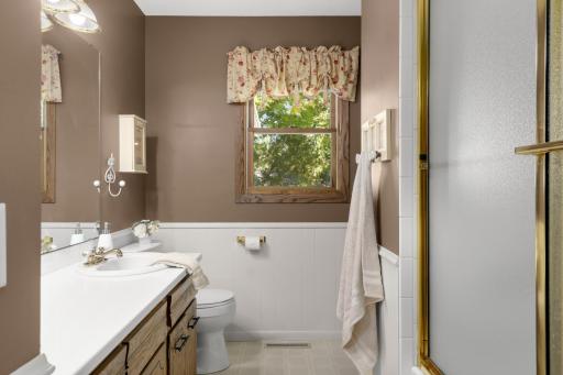 Full Bath features a large vanity with plenty of counter space.