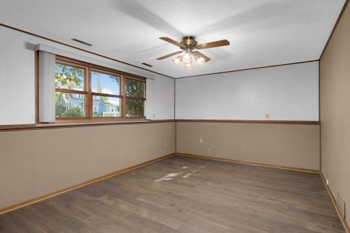 Large windows bring plenty of natural light into the lower-level Family Room.