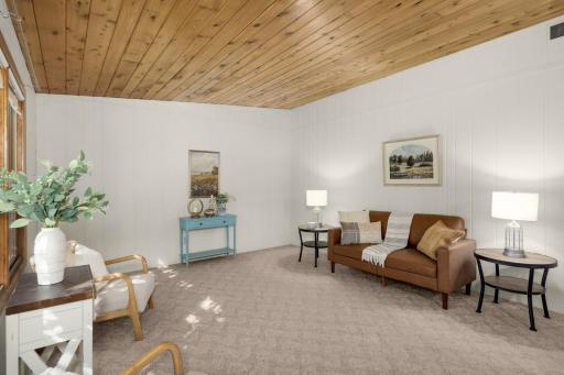 Living Room showcases the vaulted wood ceiling and natural light.