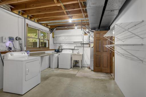 Large utility/storage room provides additional space for household items and equipment.