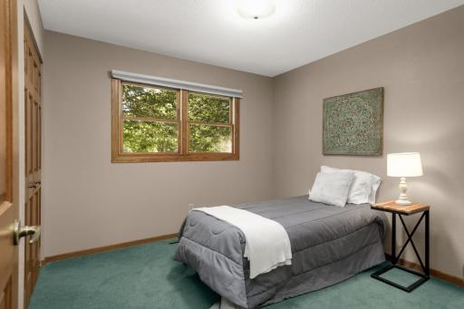 Second main-level Bedroom with a large window for natural light.