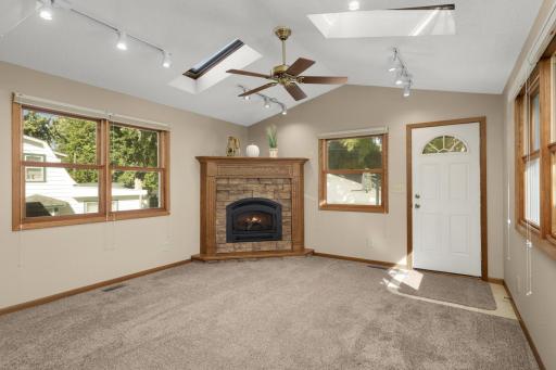 Vaulted Sunroom surrounded by windows for plenty of natural light and it provides easy access to the backyard.