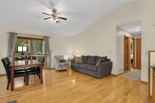 Living room with vaulted ceiling and wood flooring