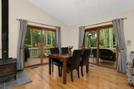 Dining area with patio doors to wrap around deck