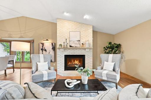 A beautiful fireplace, and an easy connection between the main living spaces create a home made for comfortable evenings in.