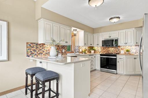 The kitchen flows naturally into casual dining, creating an easy setup for busy mornings and relaxed meals at home.