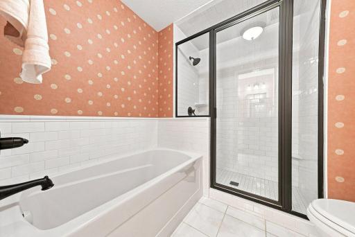 Separate soaking and shower spaces create flexibility for both everyday routines and slower mornings.
