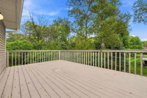 A generous deck surrounded by mature trees creates an easy place for coffee in the morning, dinner outside, or simply enjoying the view.
