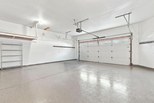 An exceptionally clean, spacious garage with built-in storage and plenty of room for the things that keep everyday life moving.