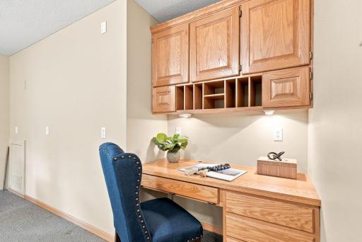 Built-in cabinetry creates a practical workstation with storage already in place.