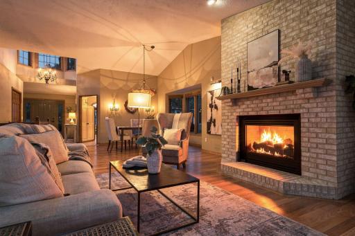This is where evenings slow down. A glowing fireplace, warm hardwood floors, and an inviting space made for gathering.