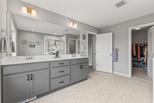 Primary Bathroom - Double sinks and TONS of storage.