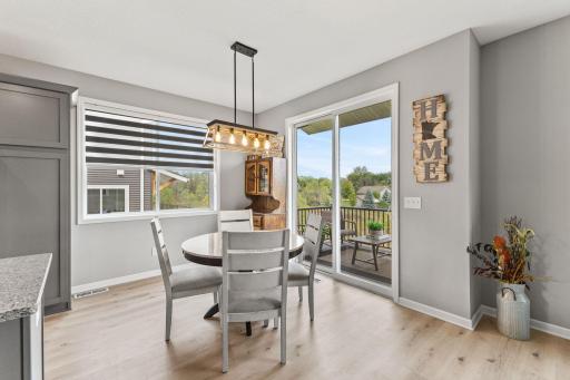 Dining Room - Custom window treatments throughout protect your privacy or let the light come through.