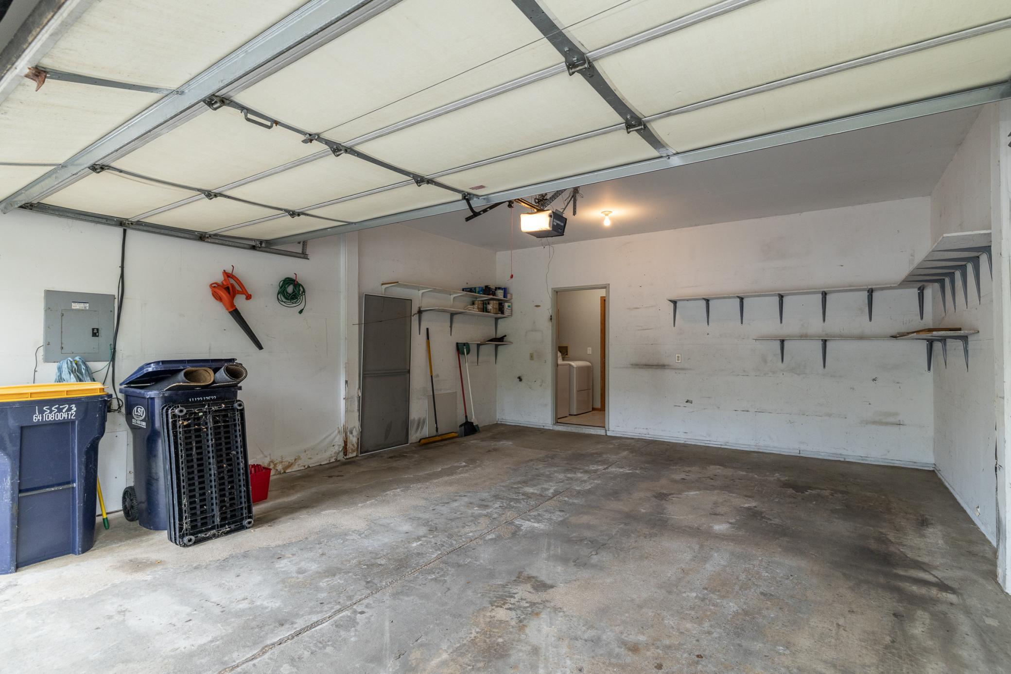 Finished garage with insulated door and water hookup