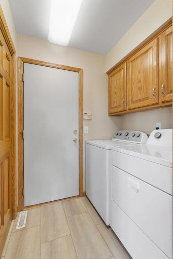 Main floor laundry - entrance from garage - new flooring