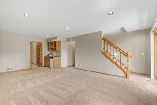 Another view of the lower family room and wet bar. The open door goes to the flex room.