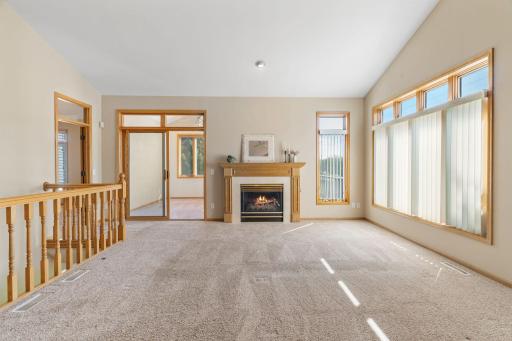 Bright and spacious main floor living room, with four season porch and primary suite adjacent.
