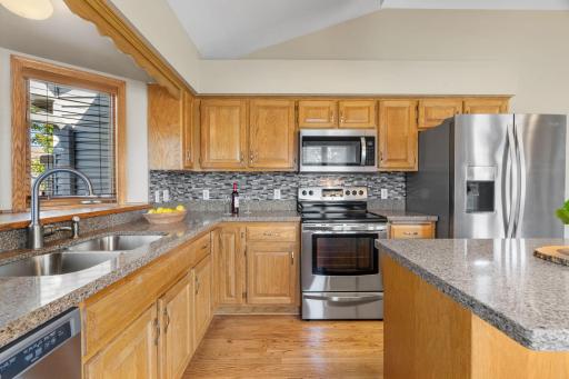 An abundance of cabinetry and countertop prep space. New dishwasher used only a couple of times!