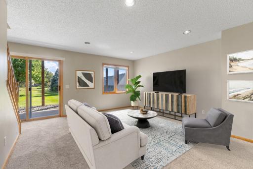Virtually staged lower level family room - walk out to the large yard